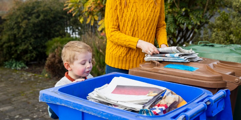 newspaper in recycling bin