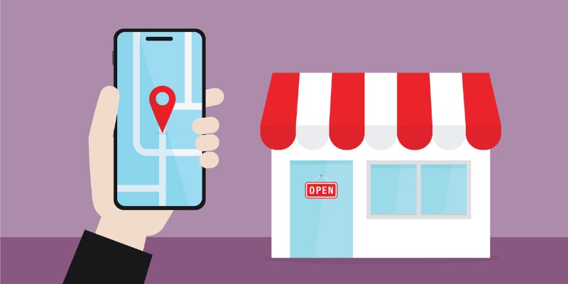 Holding mobile phone to find a business' location