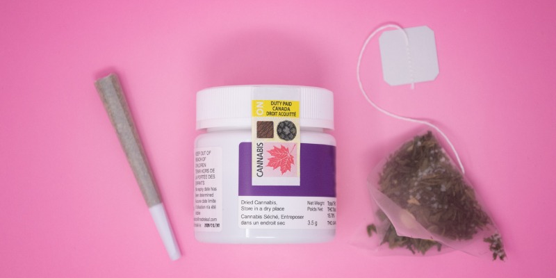various cannabis items with pink background 